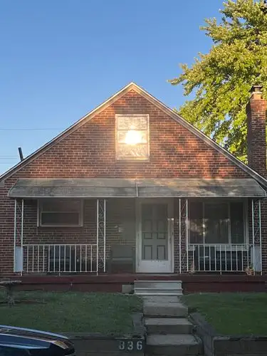 Golden hour magic on a cozy brick home.